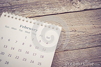 Calendar with Copy Space on Wooden Background in Vintage Tone Stock Photo