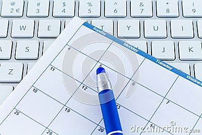 Calendar date Planner day week month with blue pen Stock Photo