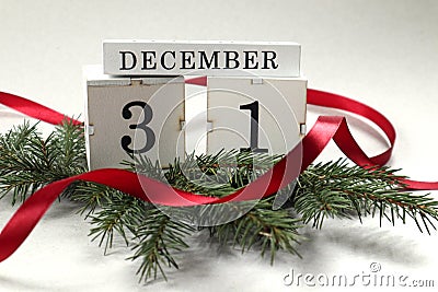 Calendar for December 31 : cubes with the numbers 3 and 1 on spruce branches, the name of the month Stock Photo