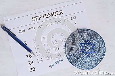 Calendar with kippah. Yom kippur concept. Stock Photo