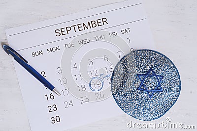 Calendar with kippah. Yom kippur concept. Stock Photo