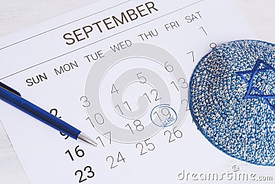 Calendar with kippah. Yom kippur concept. Stock Photo