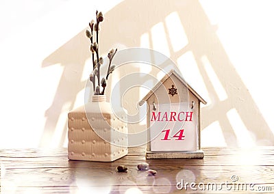 Calendar for March 14: a decorative house with the name of the month March in English, the numbers 14, a bouquet of flowering Stock Photo