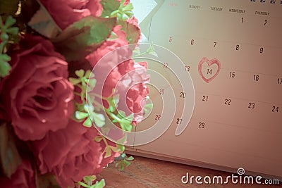 Calendar page with a red hand written heart highlight on February 14 Stock Photo