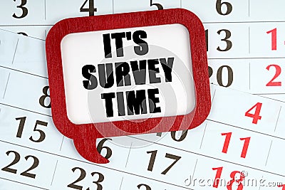 On the calendar, a red plaque with the words inside - ITS SURVEY TIME Stock Photo