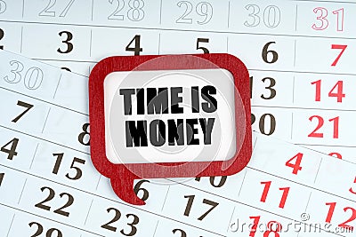 On the calendar, a red plaque with the words inside - TIME IS MONEY Stock Photo