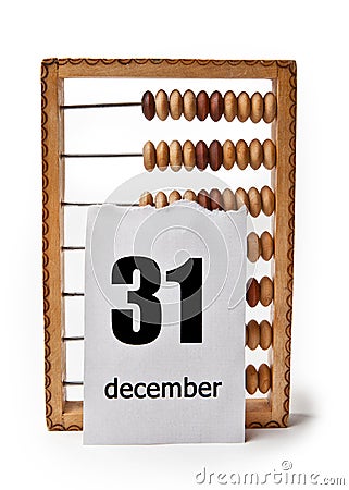 Calendar sheet with date December 31 with wooden bills Stock Photo