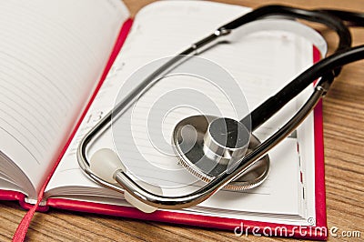 Calendar and stethoscope - booking a medical appointment Stock Photo