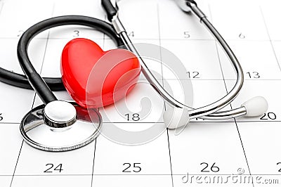 Calendar with stethoscope and red heart. Date for medical examining Stock Photo