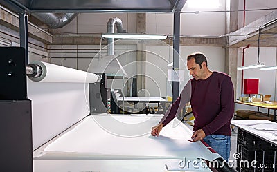 Calender transfer machine production operator man Stock Photo