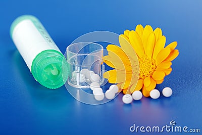 Calendula Officinalis and homeopathic pills Stock Photo