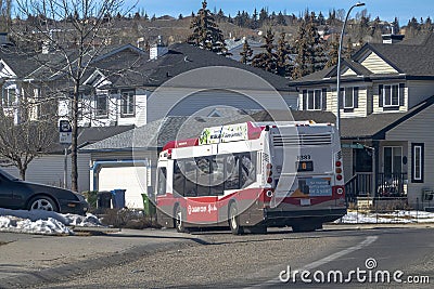 A Calgary Transit bus on the route in a neighbourhood in the NW of the city of Calgary Editorial Stock Photo