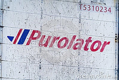 A close up to a Purolator logo to a delivery truck Editorial Stock Photo