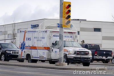 A Medical rescue support EMS van ambulance at a stop light Editorial Stock Photo