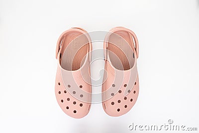 Top view of a couple of blue Crocs Sandals on a white table Editorial Stock Photo