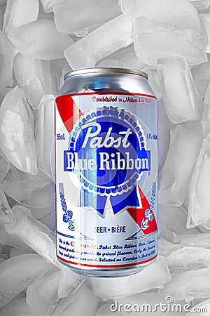 A Pabst Blue Ribbon beer can 355 ml on a bed of ice Editorial Stock Photo