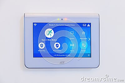 An ADT Home Security Touchscreen Panel. A command center for a smart home Editorial Stock Photo