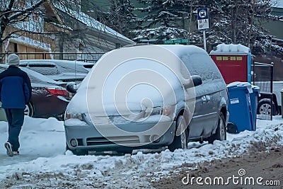 A family van covered in snow following a snowstorm Editorial Stock Photo