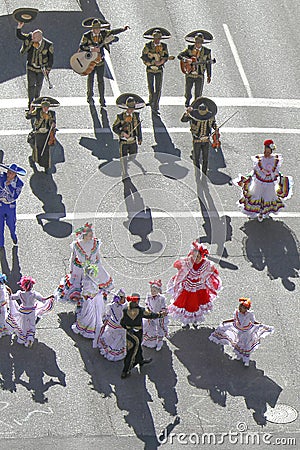 Looking down from above as a Mariachi band plays on a street during the Calgary Stampede Editorial Stock Photo