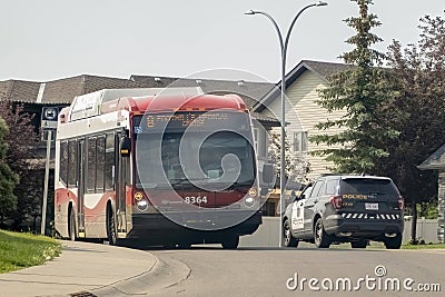 A Calgary Transit bus and a Police service car Editorial Stock Photo
