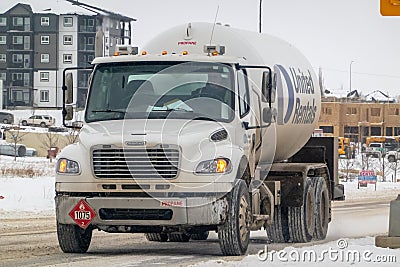 A close-up view of a propane truck navigating wintry roads on a cloudy day Editorial Stock Photo