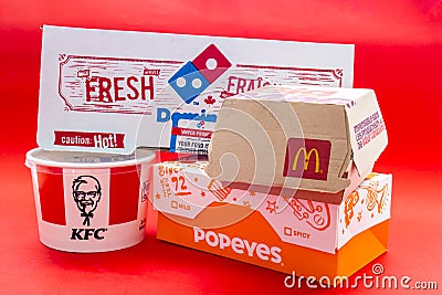 Several boxes of Fast food on a red background Editorial Stock Photo