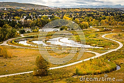 Calgary Alberta Canada, October 05 2021: Dale Hodges Park and storm retention ponds during fall colours. Stock Photo