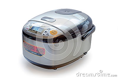 Full side view of a Zojirushi 5.5 Cup Microcomputer Rice Cooker and Warmer on a white Editorial Stock Photo