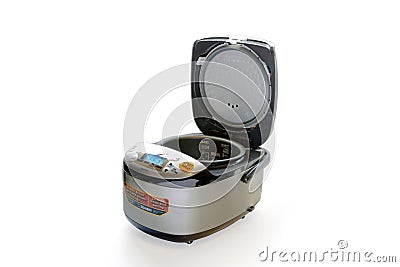 Full view of an open Zojirushi 5.5 Cup Microcomputer Rice Cooker and Warmer on a white Editorial Stock Photo