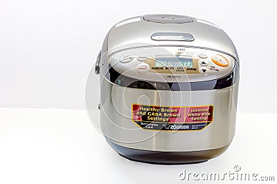 A Zojirushi 5.5 Cup Microcomputer Rice Cooker and Warmer on white background Editorial Stock Photo