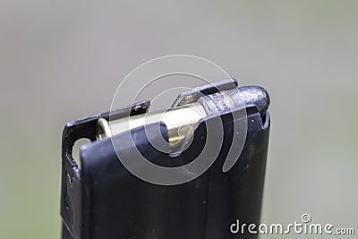 A.22 caliber bullet and clip Stock Photo