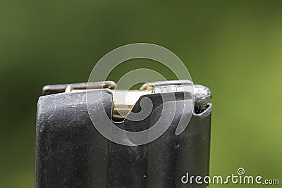 A.22 caliber bullet and clip Stock Photo