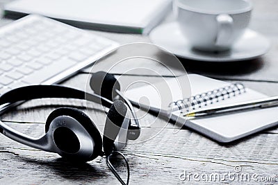 Call center manager work desk with headset and keyboard Stock Photo