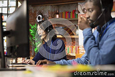 Call center operator assisting users with installing software Stock Photo