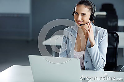 Call Center Operator Sitting Infront of Her Computer Stock Photo