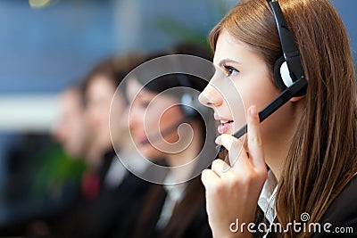 Call center operators at work Stock Photo