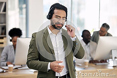 Call center, smile and consulting with man in office for customer support, telemarketing and advisory. Help desk, team Stock Photo