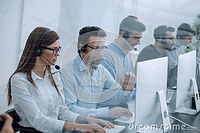 Call center staff at the workplace in the office Stock Photo