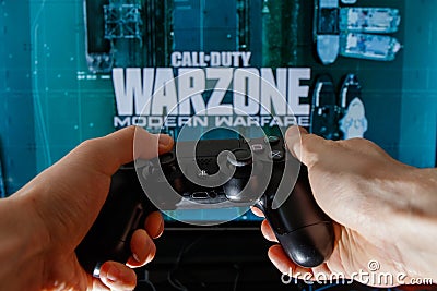 Call of Duty Warzone video game. Playing video game on Playstation 4. Editorial Stock Photo