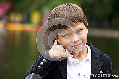 Call Me, Little Boy making a call me gesture Stock Photo