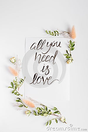 Calligraphy floral pattern top view all you need is love Stock Photo