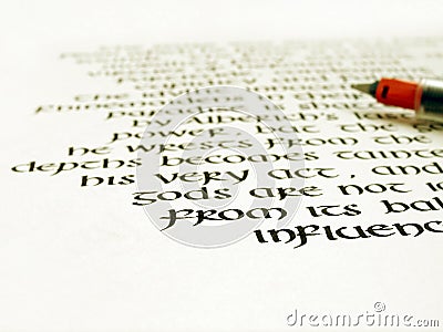 Calligraphy pen and writing on white paper Stock Photo