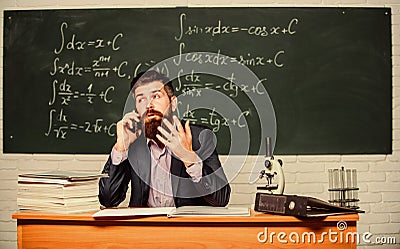 Calling parents. Call colleague ask advice. Teacher bearded man talk mobile phone. Pedagogue keep in touch with Stock Photo