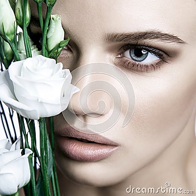 Calm Beauty Fashion Model Woman face. Portrait with white Rose flower. Stock Photo