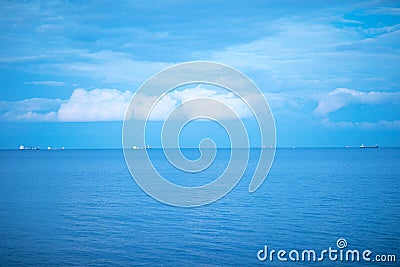 Calm blue sea with ships. Stock Photo