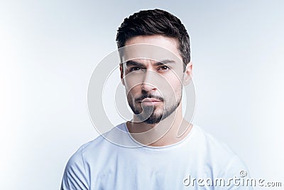 Calm demanding young teacher waiting for his students Stock Photo