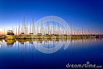 Calm evening in sailing harbor Stock Photo