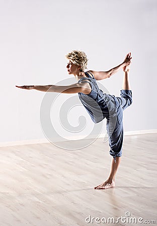 Calm female in perfect balance while holding foot Stock Photo