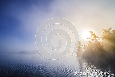 Calm Foggy Lake in the Morning Stock Photo