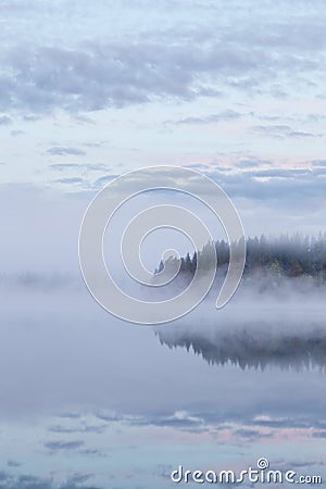 Calm foggy lake scape summer night Stock Photo